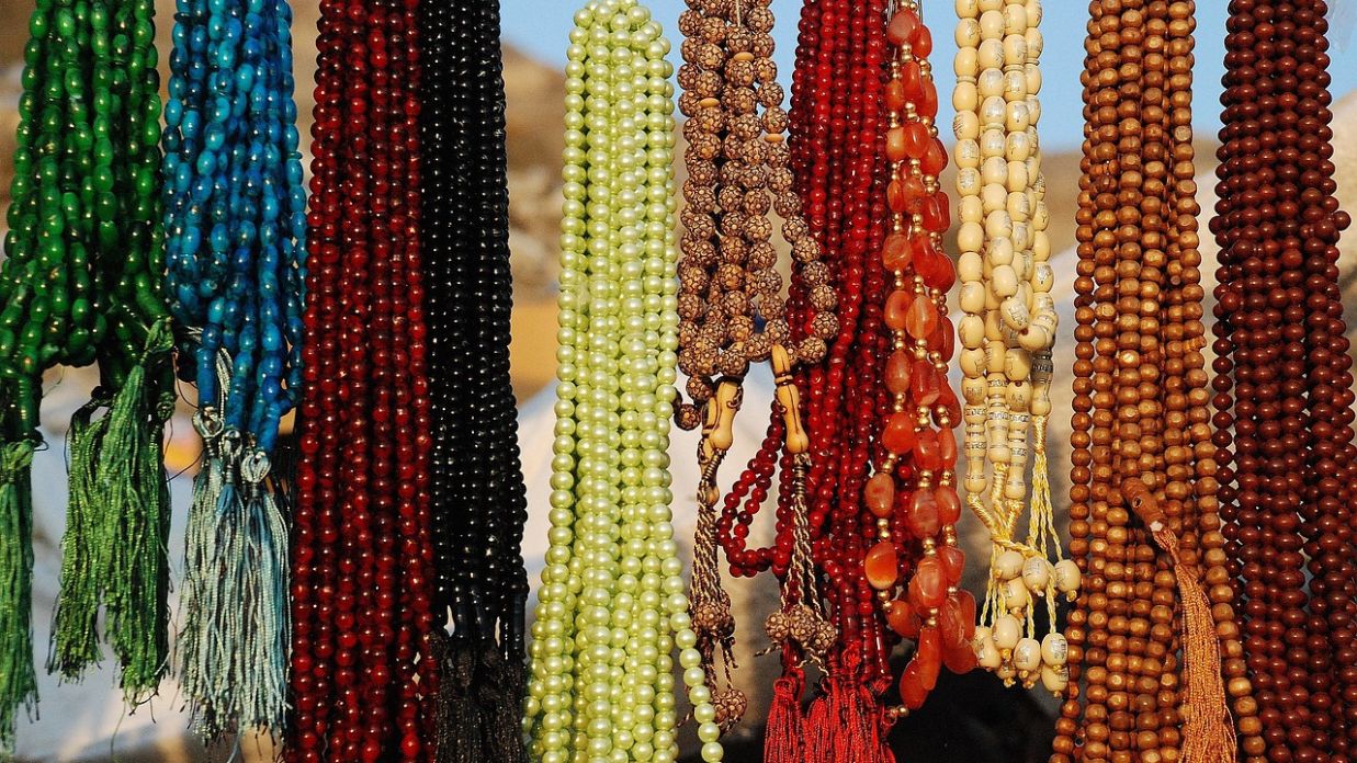 bunch of multi-colored beaded necklaces